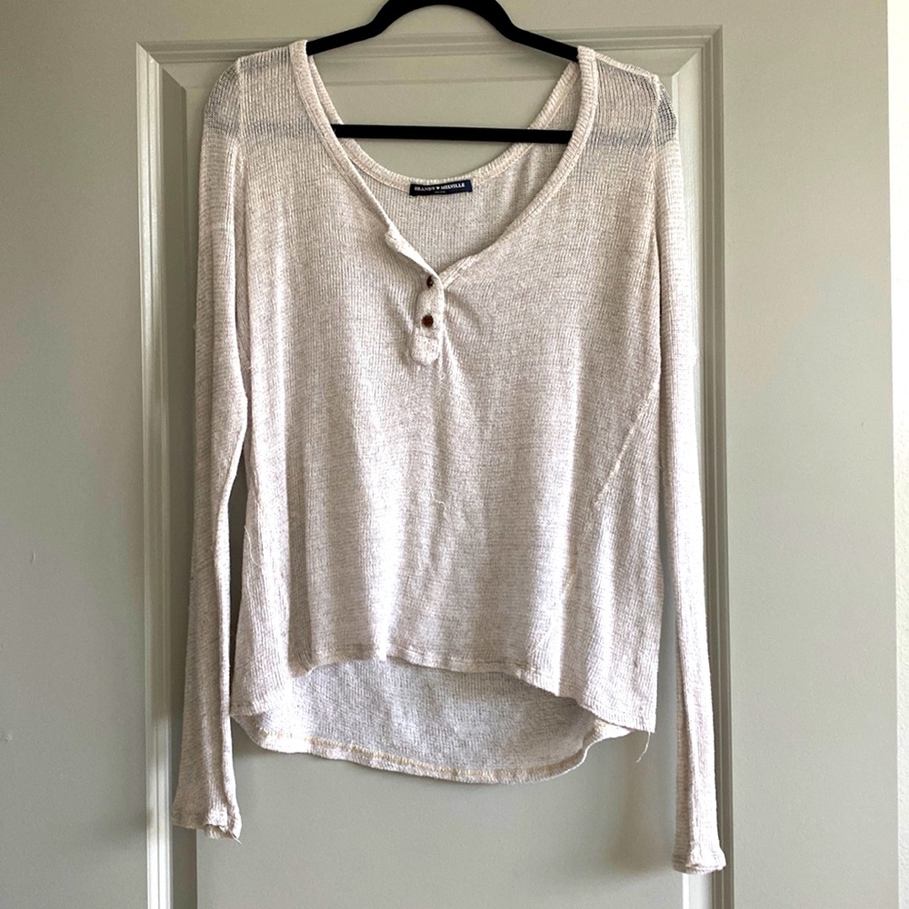 Sheer, cream long sleeve top